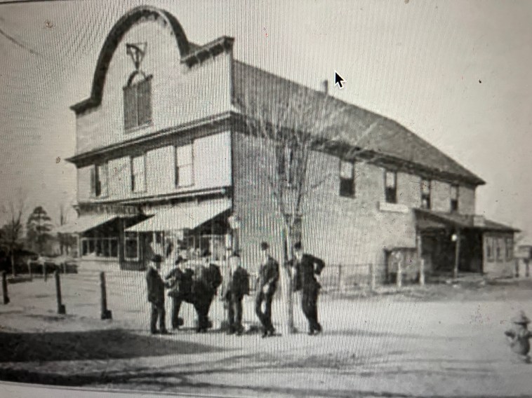 The John L. Roper Lumber Co.'s company store in Roper, Washington County, N.C., ca. 1907. Lee's Mill-- the name of the settlement until the Roper Lumber Co. arrived in 1889-- had been the site of comparatively small-scale shingle and lumber mills since the first half of the 18th century. The mills' output was loaded onto barges and floated down Kendrick's Creek to Mackeys, on the south shore of the Albemarle Sound, and loaded onto seagoing vessels for shipment north. When the lumber company and the Norfolk & Southern Railroad arrived to exploit the forests of the East Dismal Swamp, everything changed, including the village's name. Hundreds of new residents came to work in the company's mills. Electric lights illuminated the streets. Shops, boardinghouses, liquor houses and the like opened in the booming village, as well as the impressive company store that we see here, which was part grocery, part hardware store, part pharmacy, and part bank (or perhaps more accurately, part payday lender). Trains came and went every day, and the voices of people from all over the U.S. could be heard in the village streets. Among them were gangs of recent immigrants-- Russians, Poles, Italians, Hungarians, Greeks and others-- recruited by labor agents to build logging railroads and to work in the mills and logwoods of the East Dismal. Photo from American Lumberman, April 27, 1907.