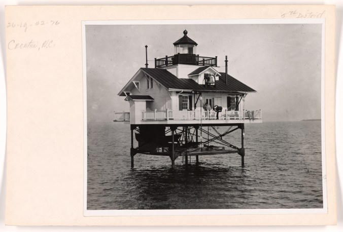 Croatan Lighthouse, in the channel between Croatan Sound and Albemarle Sound, 1914. As that time, the Croatan Light was one of 14 manned lighthouses on piles on North Carolina waters. The Wade Point, North River, Laurel Point, and Roanoke River lighthouses all stood on the Albemarle Sound or at the mouth of its tributaries. The Long Shoal, Hatteras Inlet, Bluff Shoal, Gull Shoal, Brant Island, Southwest Point Royal Shoal, and Pamlico Point lighthouses were all located on Pamlico Sound. The Croatan Lighthouse, seen here, was  northwest of Roanoke Island. Another lighthouse, the Harbor Island Light, was located at the entrance to Core Sound, not far from Portsmouth Island, and the Neuse River Lighthouse stood off Piney Point at the entrance to the Neuse River. According to the <a href="https://www.history.uscg.mil">U.S. Coast Guard Historian's Office</a>, the Croatan Lighthouse had a <a href="https://www.nps.gov/articles/fresnel-lens.htm">Fourth Order Fresnal Lens</a>, as well as a fog bell that struck every 15 seconds when in use. Photo source:  Records of the U.S. Coast Guard, (RG 23), National Archives- College Park- (#45693945)