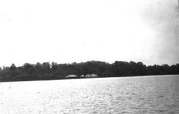 This is probably Kitty Hawk, Roy Hampton's fishery on the north side of the Roanoke, as seen from the Slade fishery on the other side of the river. The buildings included a packing and salting house, engine shed, a mess hall, and barracks. Photo courtesy, State Archives of North Carolina