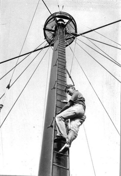 Here we see the one of the Diamond Shoal Lightship's crewmen descending a mast after servicing or cleaning one of the vessel's two beacons. Photo courtesy, State Archives of North Carolina