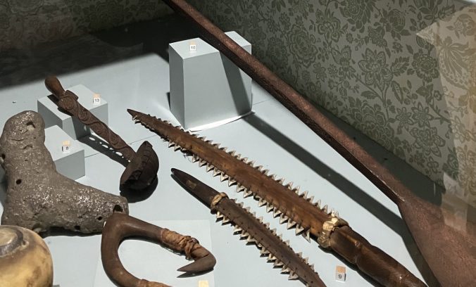 Relics of sea voyages can be found here and there throughout the Athenaeum. Here we see, among other things, a pair of shark-tooth daggers from the Gilbert Islands (now Kiribati) in the Central Pacific, ca. 1820. Photo by David Cecelski