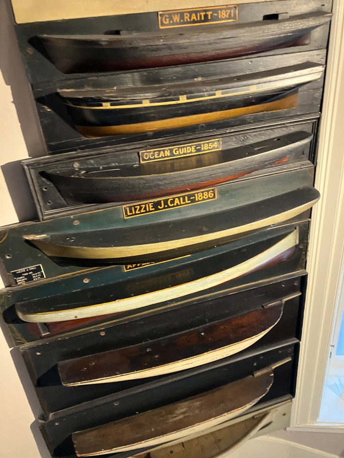 A few of the 19th-century half-hull ship models in the Athenaeum's collection. Shipbuilders used such models extensively in constructing sailing vessels in the Age of Sail, as well as in documenting ships that were built. Photo by David Cecelski