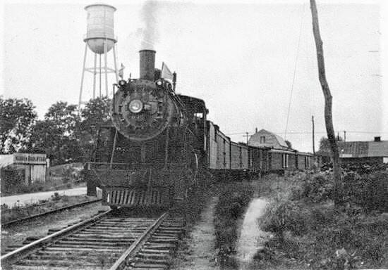 A freight train leaving Clinton, N.C., ca. 1935-45. The arrival of railroads opened large sections of Eastern N.C. up to truck farming in the late 19th and early 20th centuries. Sampson County grew famous for its wild blueberries, but many communities also became almost synonymous with a particular cultivated fruit or vegetable-- Chadbourn and Mt. Olive with strawberries, Bogue Sound with watermelons, Rockyhock with cantaloupes, Aurora with white potatoes, and many others. Photo courtesy, The Sampson Independent, 6 April 2022