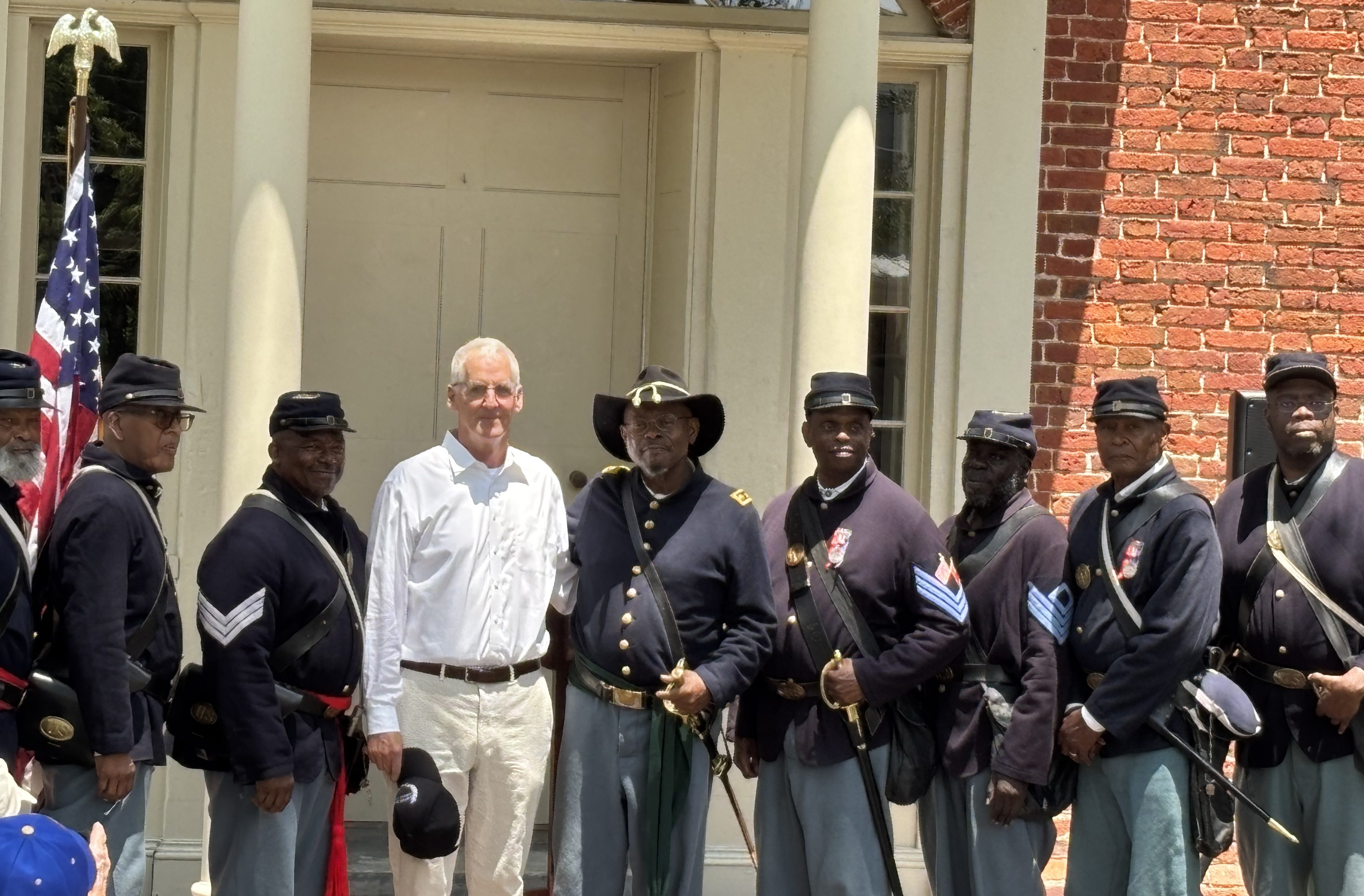 Bernard George and I (center) standing with his comrades in the 35th USCT Reenactors Group at the Black Troops Commemorative Ceremony that was held last Saturday on the grounds of the New Bern Academy Museum in New Bern, N.C. Photo by Laura Hanson 