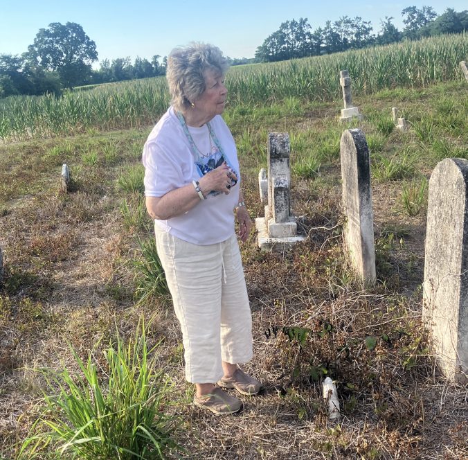 Ms. Ida Brown at the community cemetery in Institute, N.C. Photo by David Cecelski