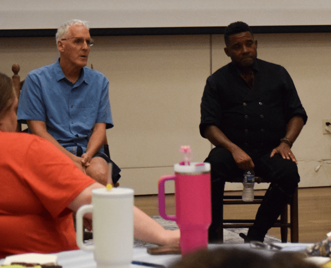 Mike was performing for a workshop and retreat that Carolina K-12 had organized for school teachers from across North Carolina. They gave him a standing ovation, then I joined him on stage for a Q & A session with the teachers. Photo courtesy, Carolina K-12